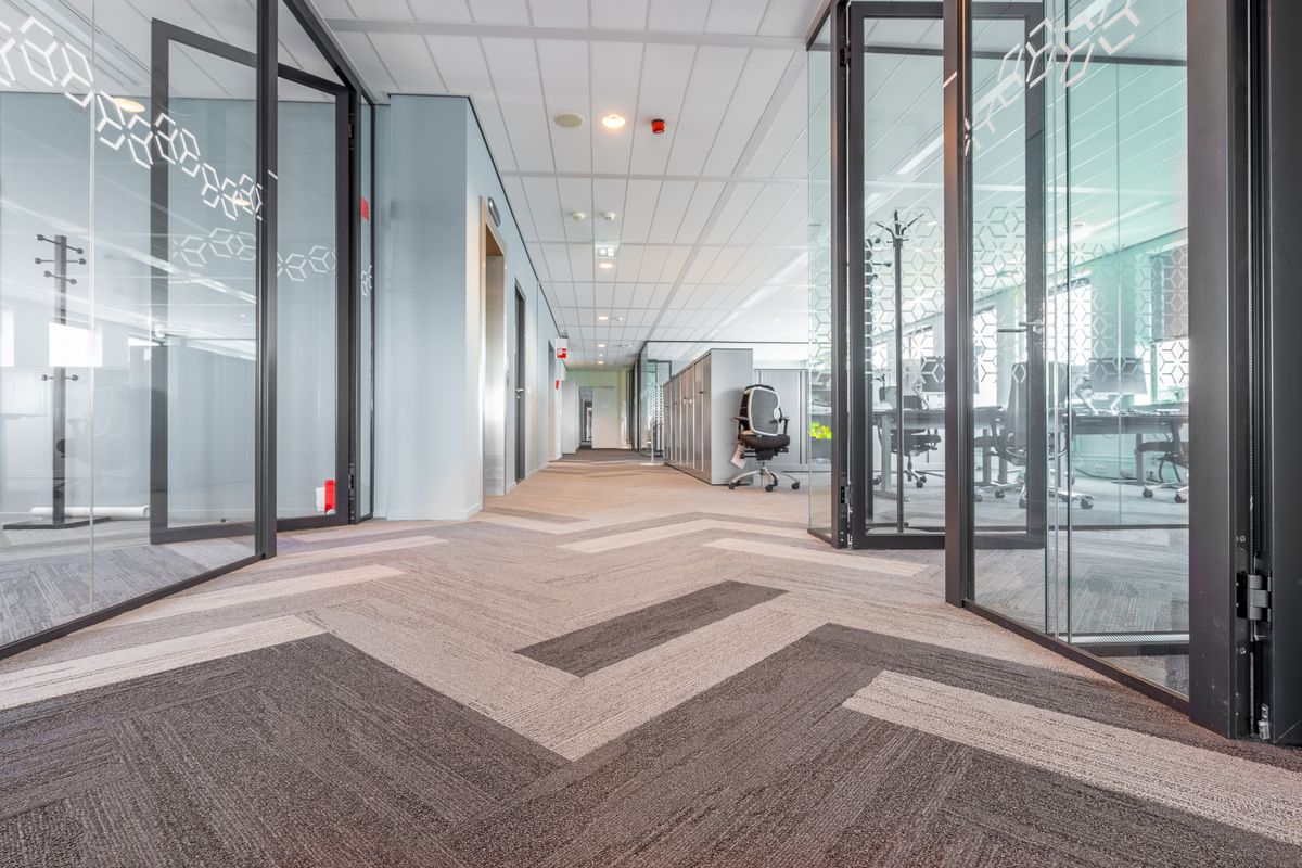 Modern building corridor with fire-rated glazed doors