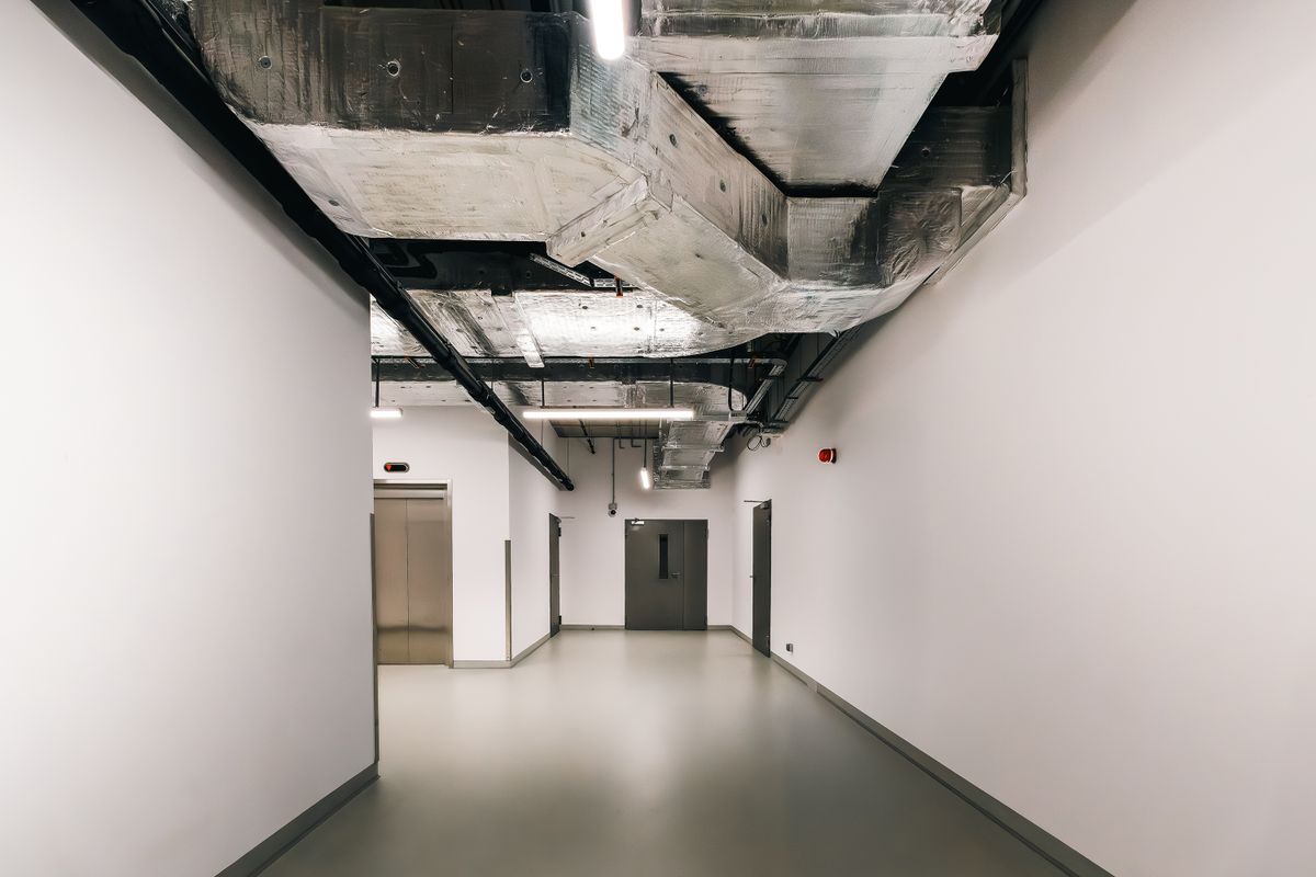 Building services and ductwork in a compartmented corridor
